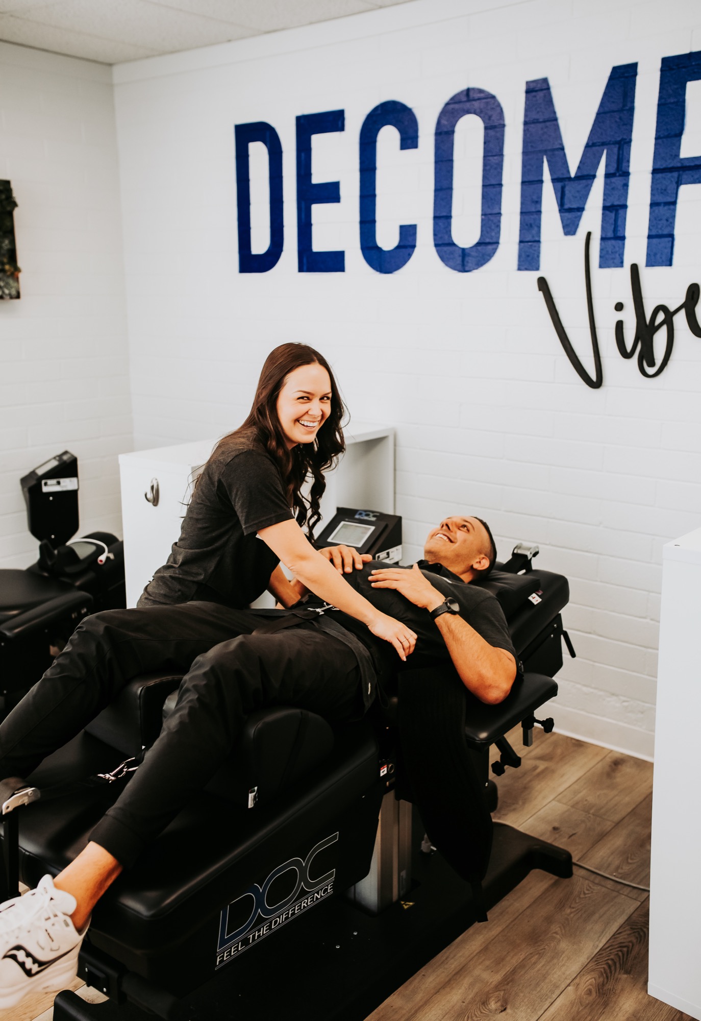 A staff member positioning a patient on a DOC decompression table